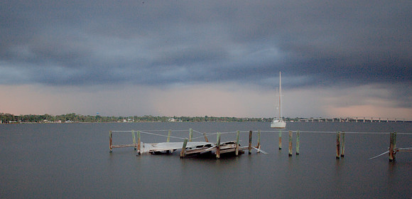 Broken Dock and Boat at Dusk